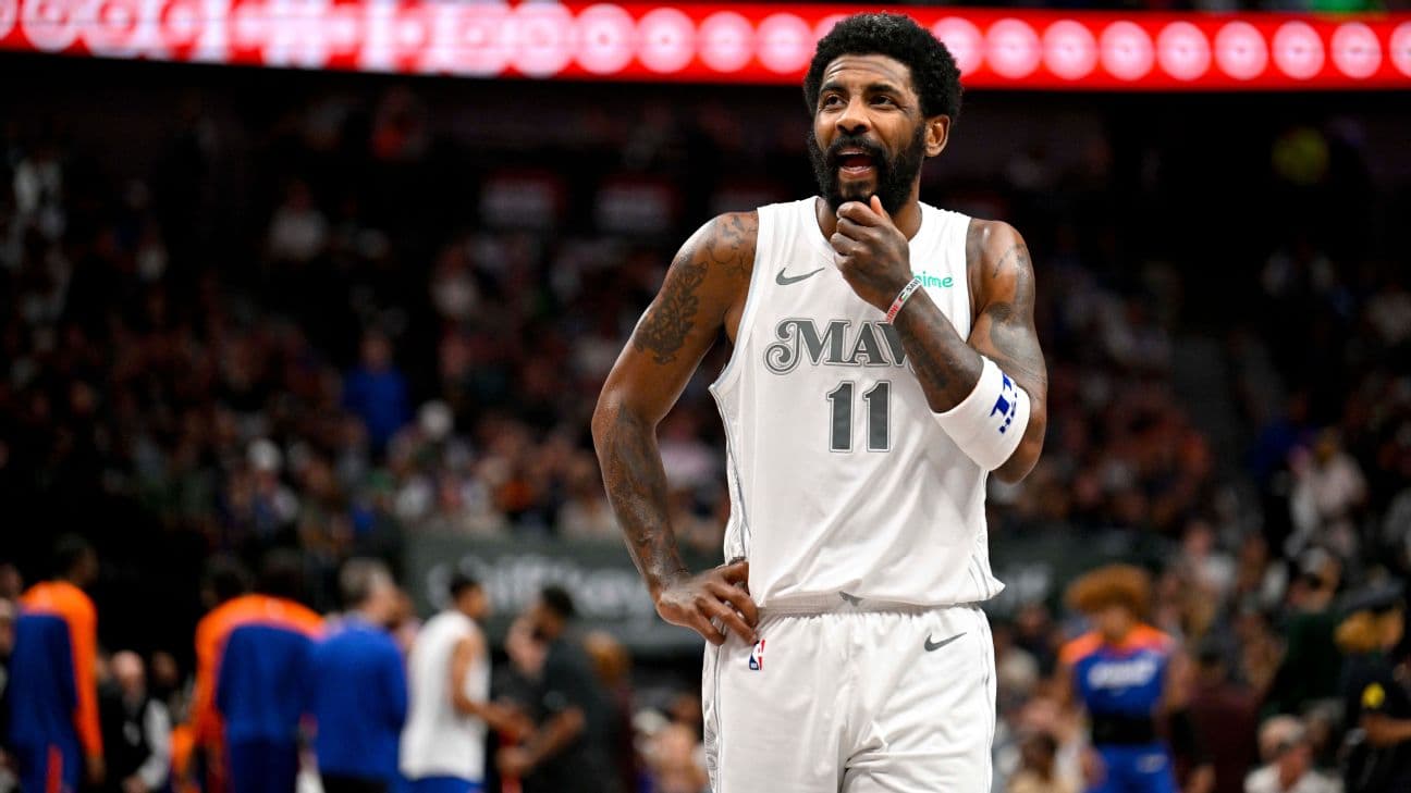Dallas Mavericks guard Kyrie Irving (11) walks back up the court during the first quarter against the New York Knicks at the American Airlines Center.