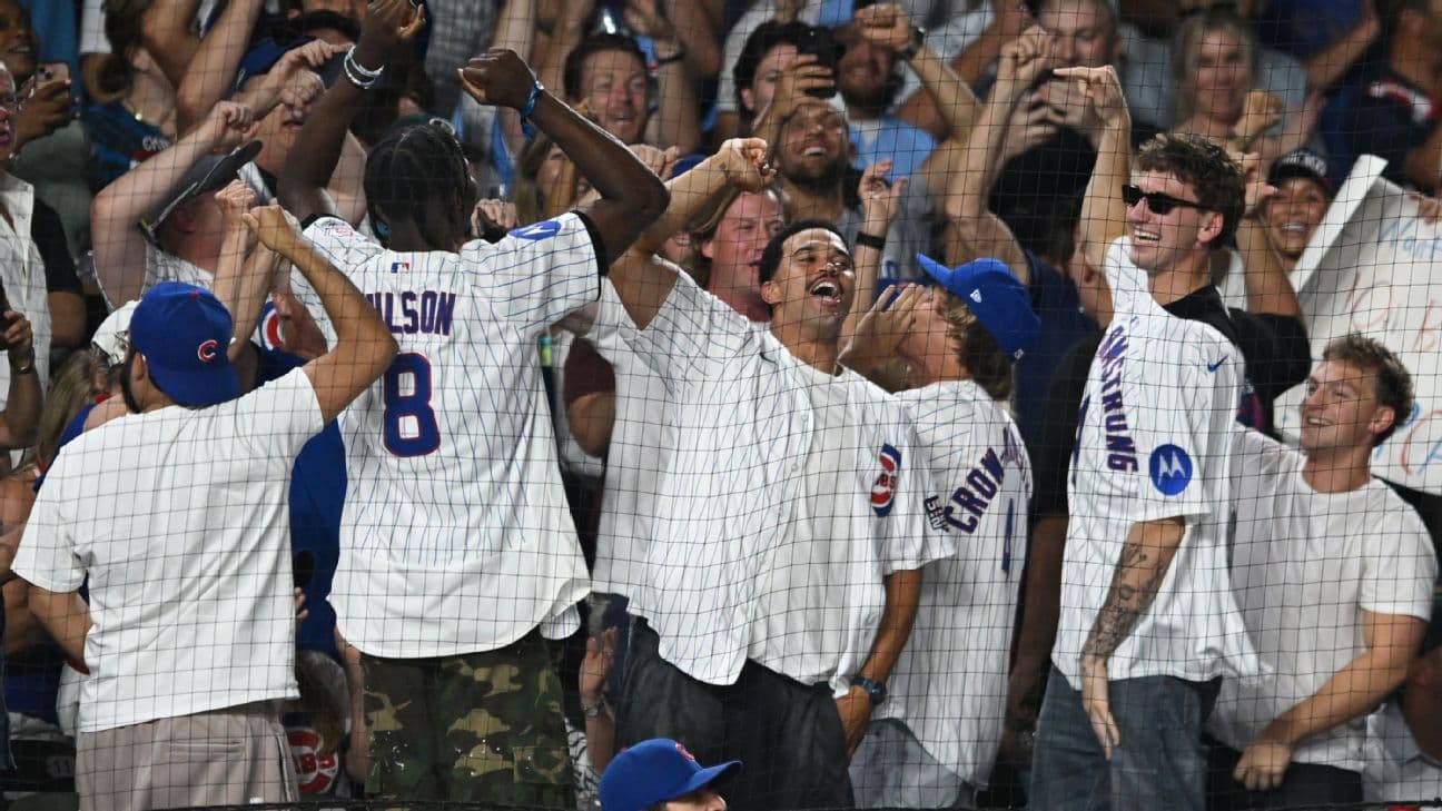 Caleb Williams, center, Bulls players Caleb Wilson, left, and Matas Buzelis (sunglasses) along with music video director Cole Bennett, third from right, cheered on PCA at Wrigley on Sept. 3.