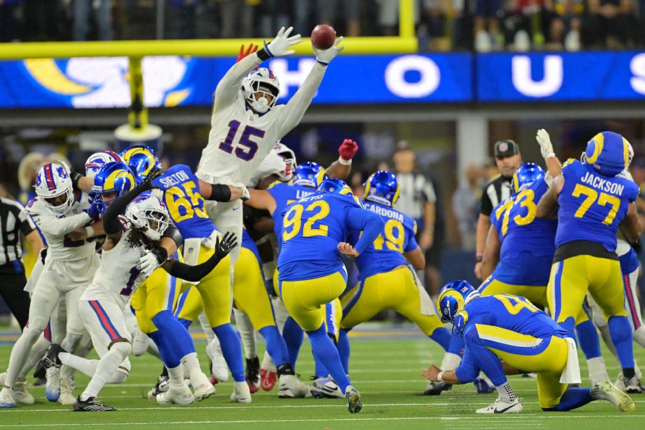 Greg Rousseau (15) blocks a field goal from Los Angeles Rams place kicker Harrison Mevis
