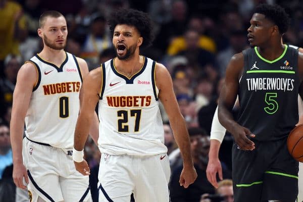 Nuggets guard Jamal Murray, middle, missed all eight of his 3-point attempts Saturday but went 16-of-16 from the free throw line to key his 30-point performance in Game 1.