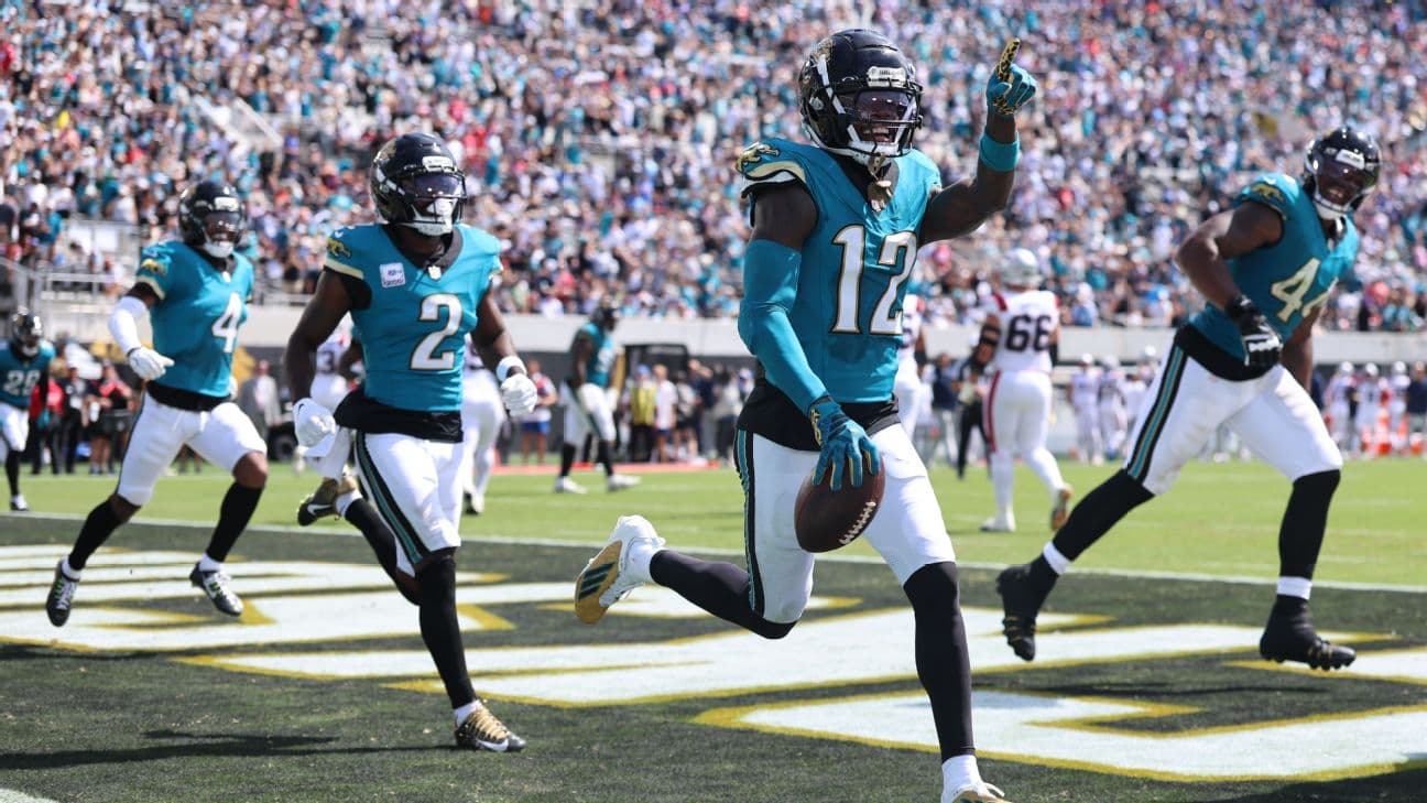 Travis Hunter celebrates his first NFL interception Sunday against the Patriots.