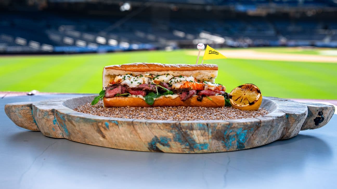 Wood-fired New York strip and lobster, old bay butter, lemon garlic aioli and chive on a torpedo roll.